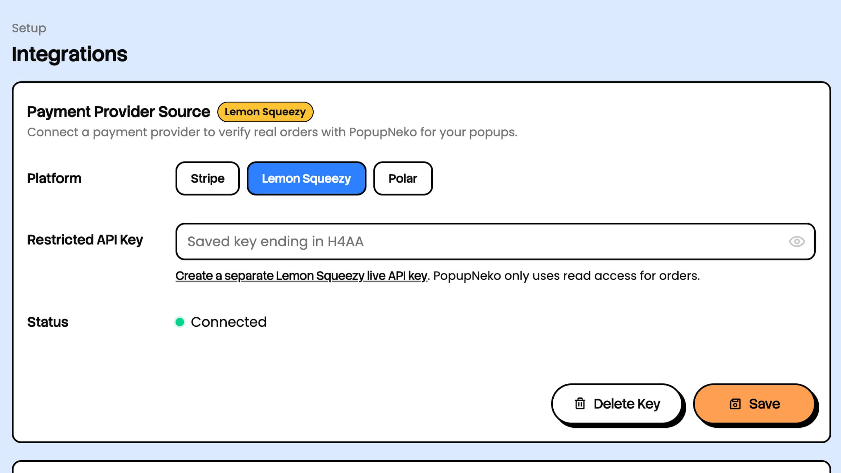 Lemon Squeezy selected in PopupNeko Integrations, with a masked saved restricted key and Connected status